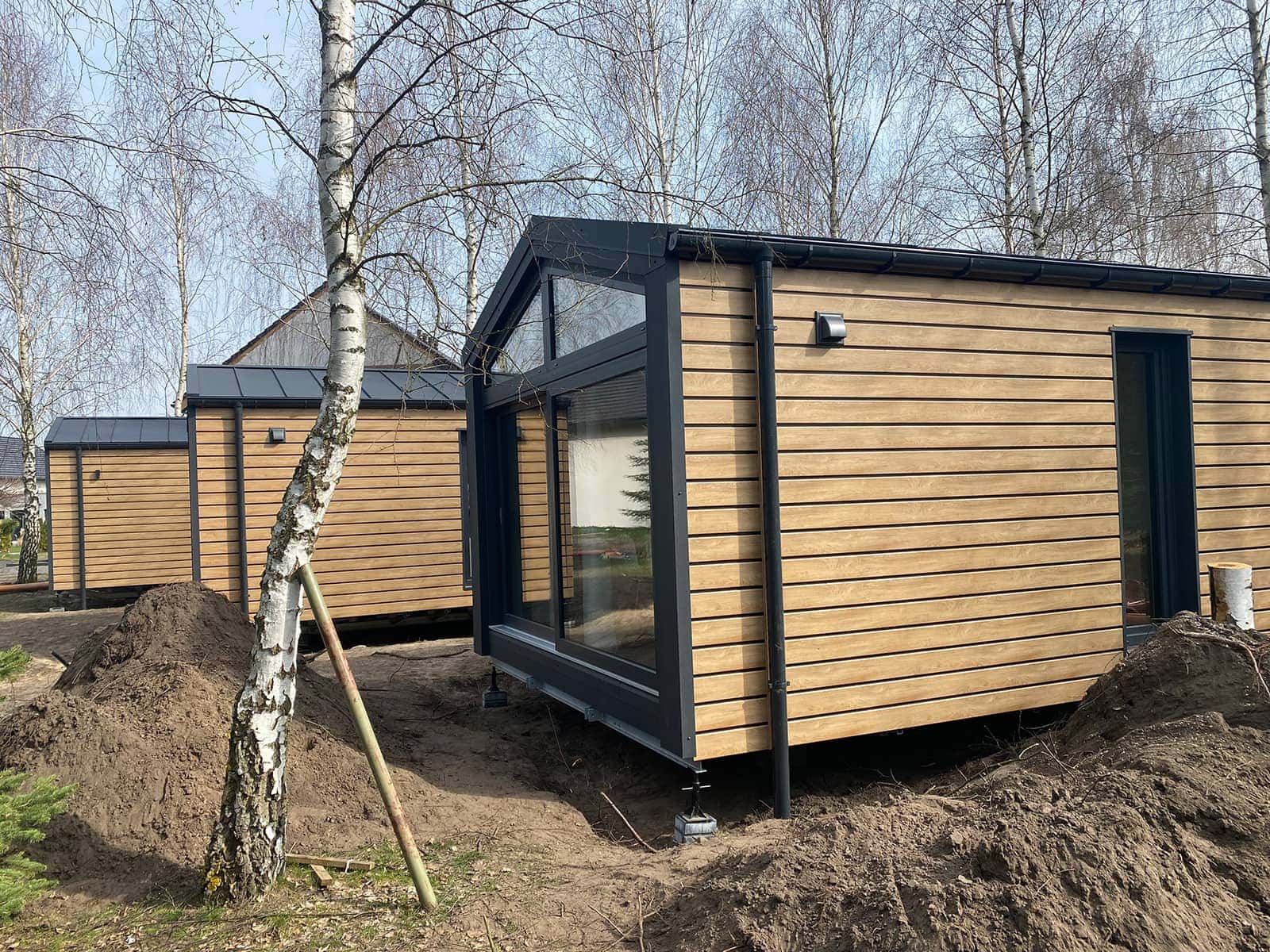 Tatradomy mobile home E on a plot in a campsite setting beneath the Tatras